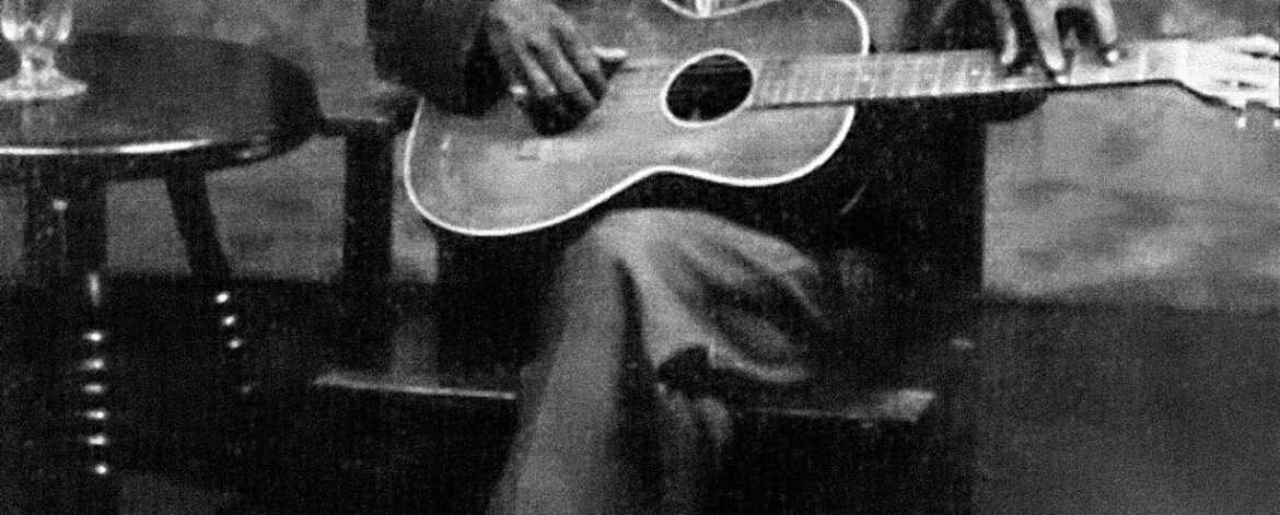 charley_patton_1929_stella_guitar Charley Patton seated holding a Stella guitar in a Paramount publicity portrait circa 1929