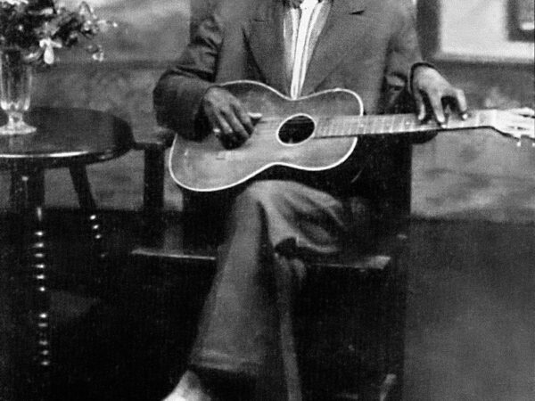 charley_patton_1929_stella_guitar Charley Patton seated holding a Stella guitar in a Paramount publicity portrait circa 1929