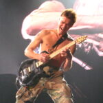 Eddie Van Halen playing rock guitar techniques on stage in Montreal 2007