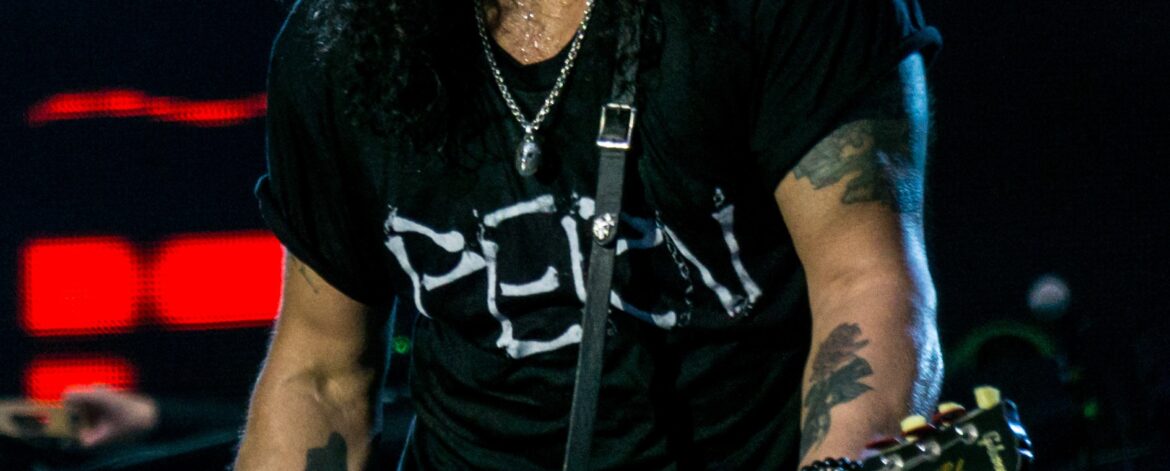 Slash playing guitar on stage with Guns N' Roses in June 2017