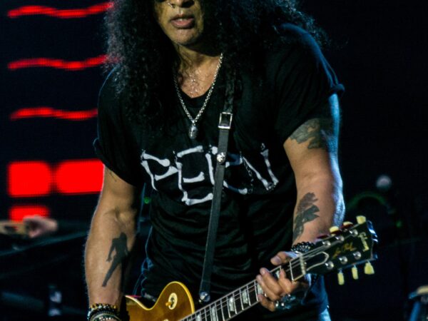 Slash playing guitar on stage with Guns N' Roses in June 2017