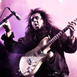 Yngwie Malmsteen playing guitar on stage in Moscow 2010