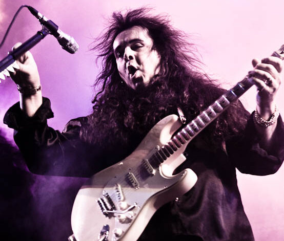 Yngwie Malmsteen Yngwie Malmsteen playing guitar on stage in Moscow 2010