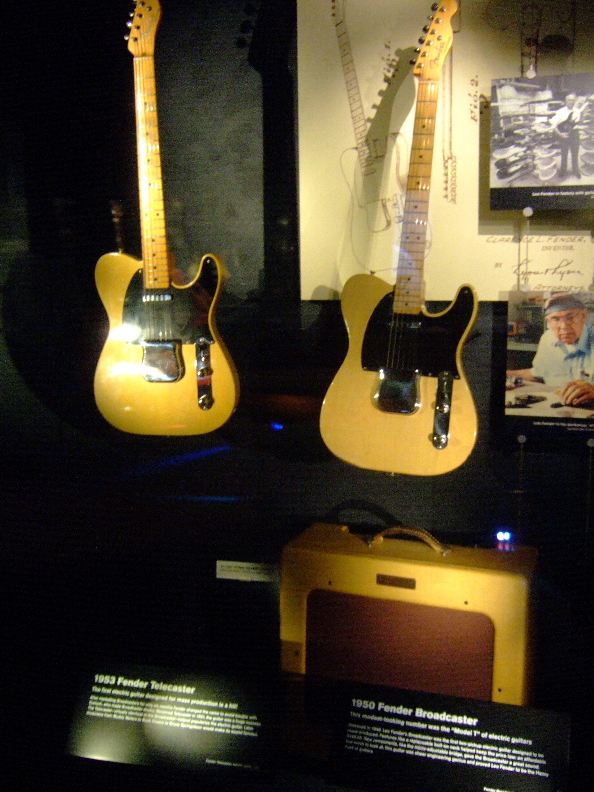 Stratocaster vs Telecaster history: Fender Broadcaster from 1950 beside a 1953 Telecaster in a museum display