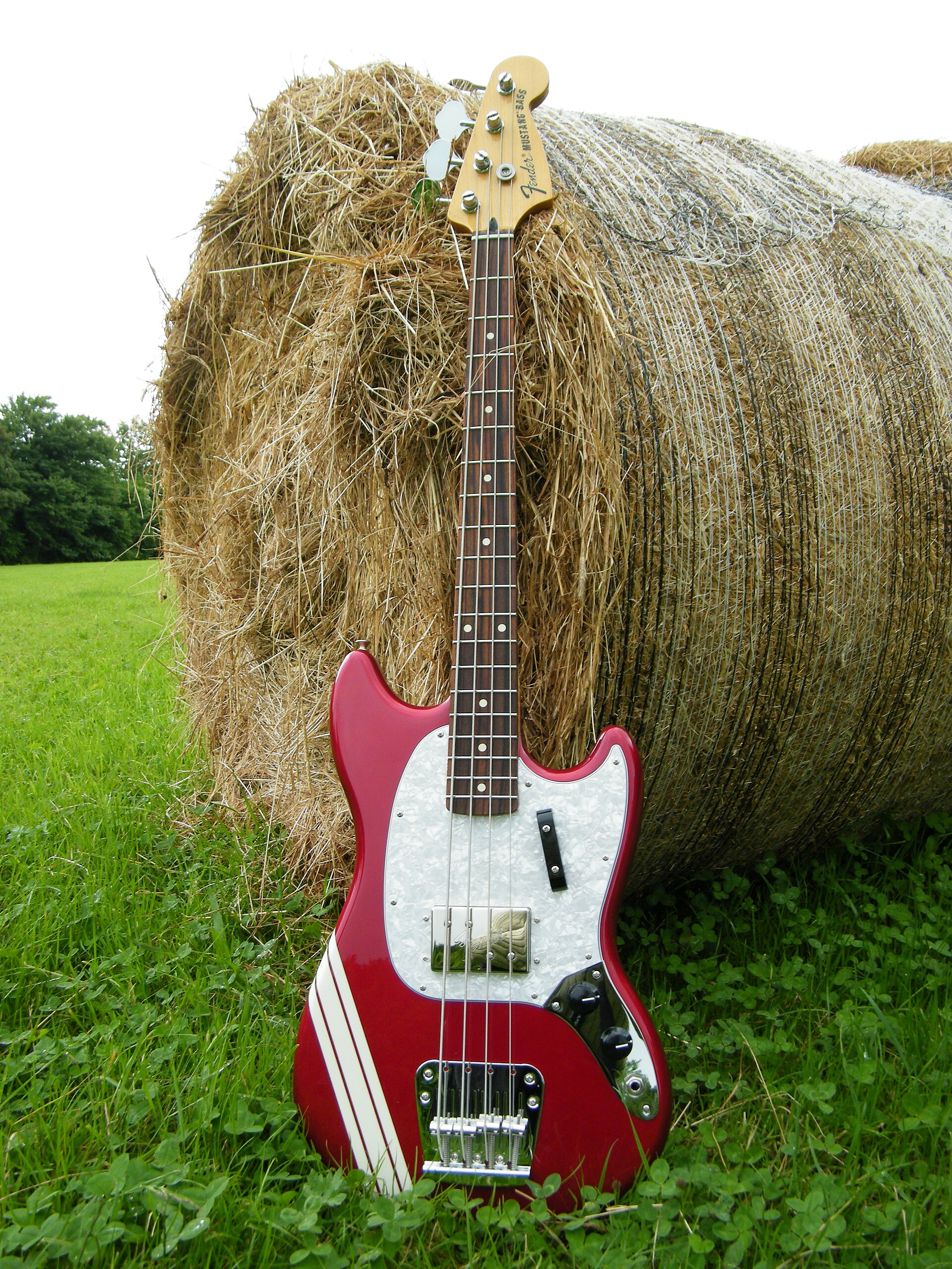 Red Fender Mustang short scale bass with white racing stripes