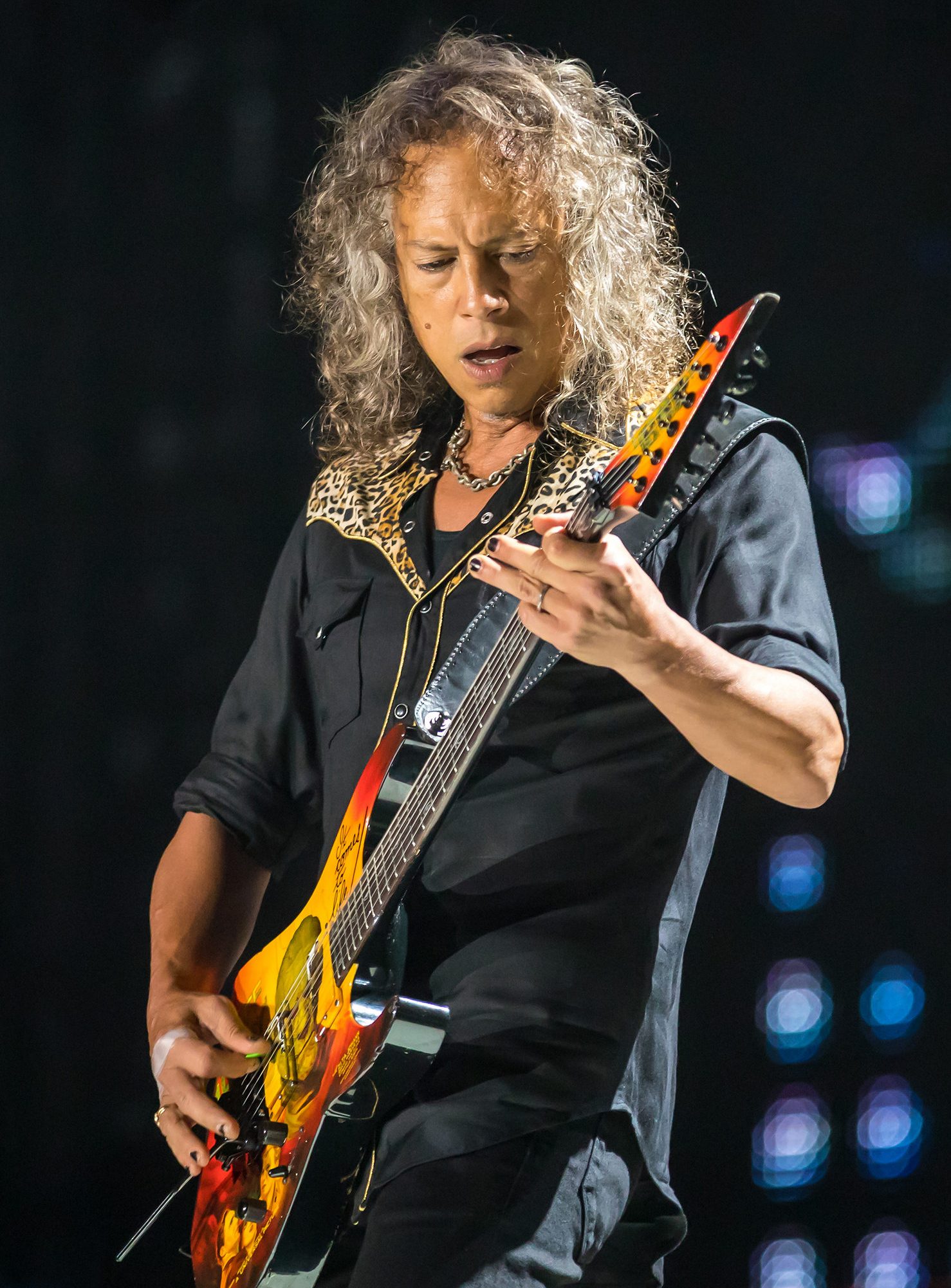 Kirk Hammett of Metallica playing guitar on stage in San Antonio in 2017
